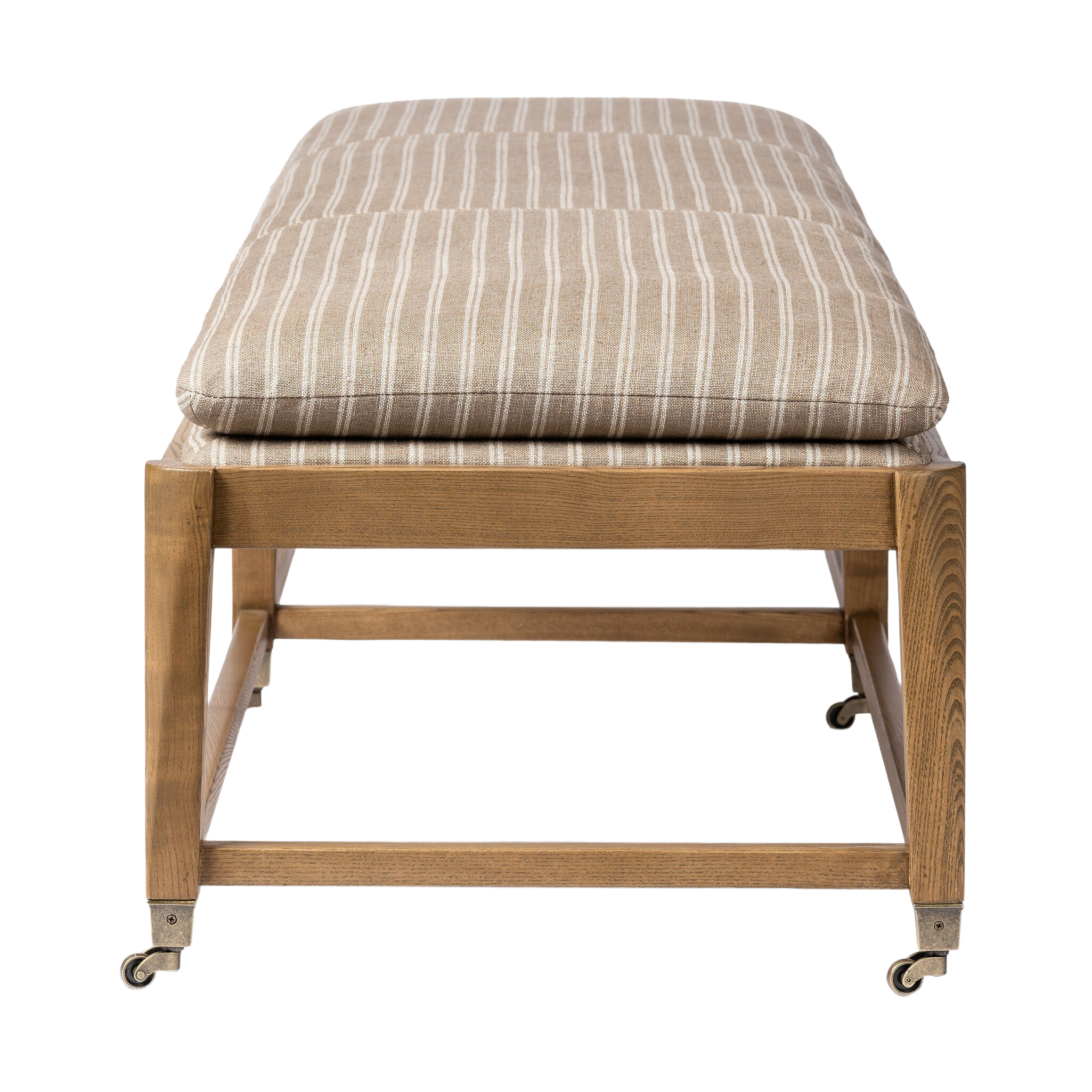 End view of the Serafina Bench showing the softly rounded striped cushion, wood frame construction, stretcher detailing and caster feet.