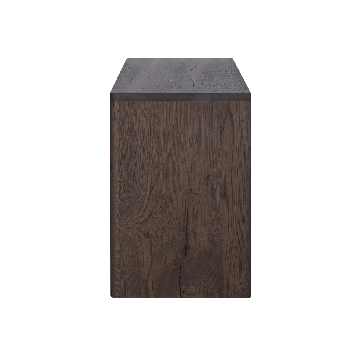 Side view of the Hewitt Sideboard showing its substantial rectangular profile, dark oak grain and clean, hardware-free construction.