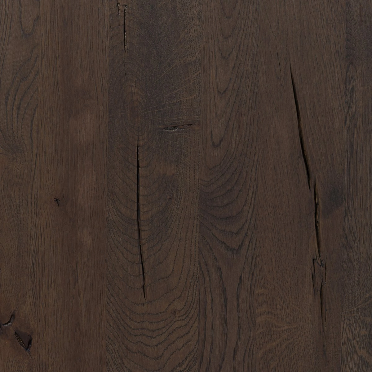 Detail of the Hewitt Sideboard oak surface showing natural knots, cracks and expressive grain characteristic of the wood.