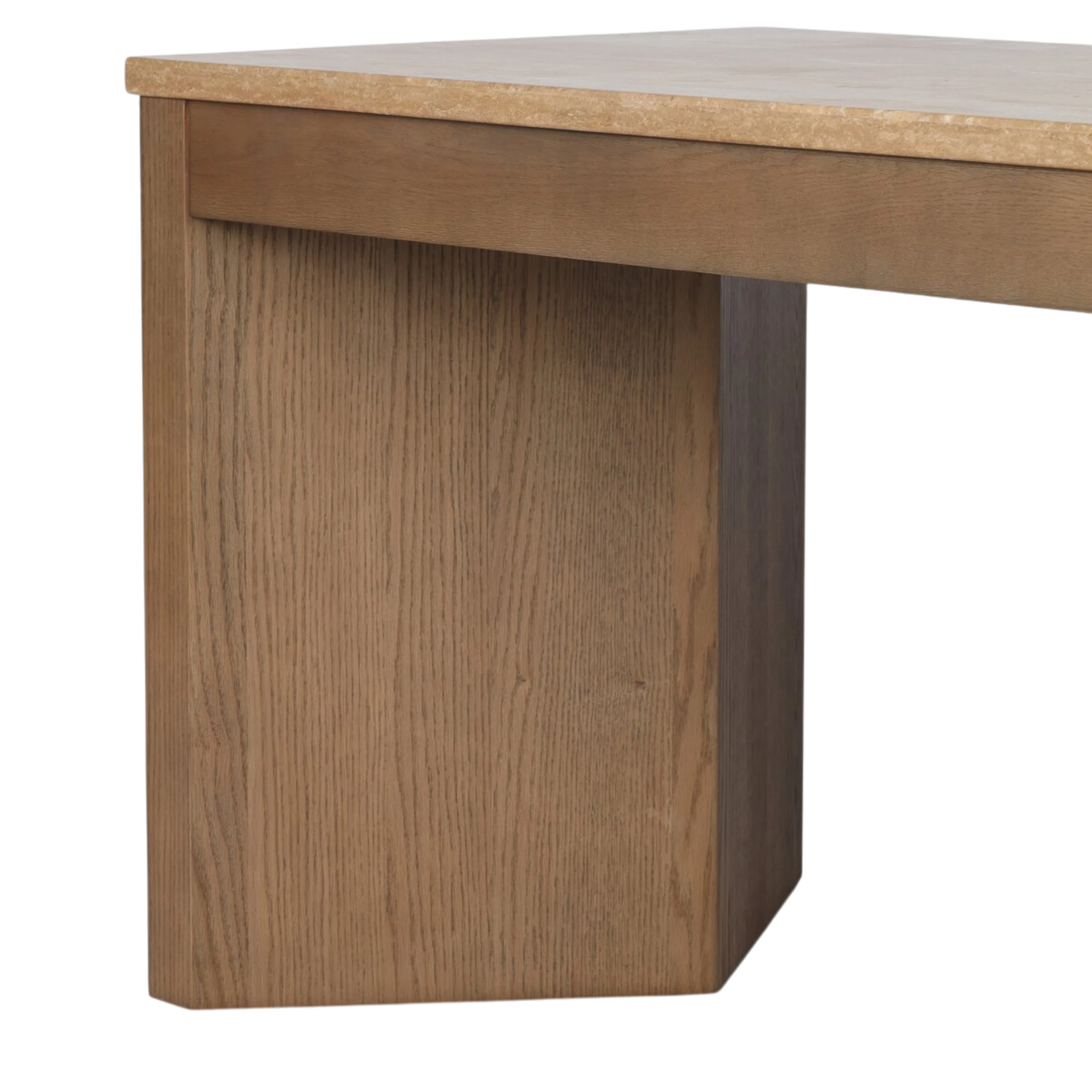 Close-up of the Cobble Desk showing the oak panel leg, integrated drawer front and warm-toned travertine surface.