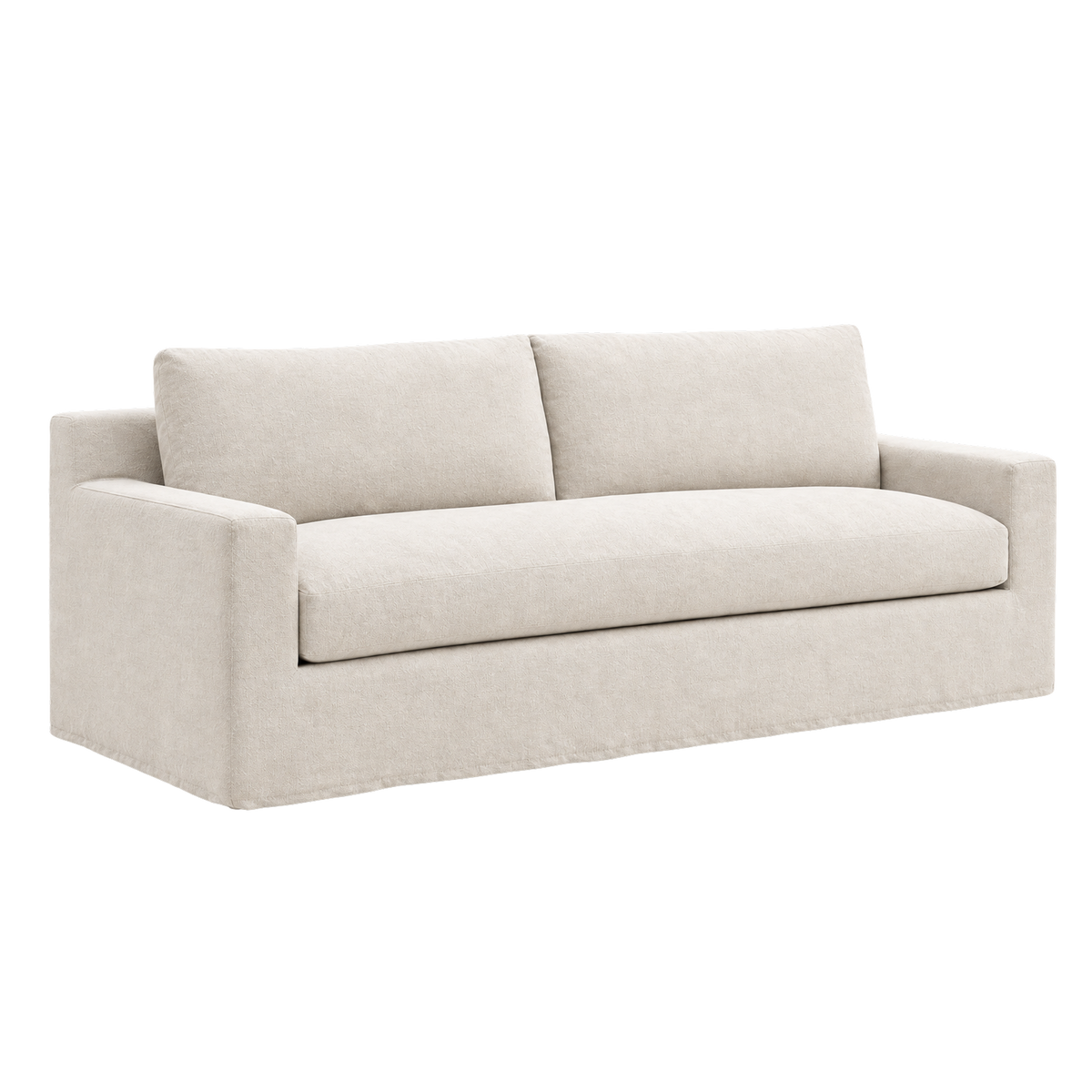 Babylon Sofa angled view highlighting the natural linen upholstery, with a wide bench seat, boxy track arms and a clean, unbroken base skirting the floor.