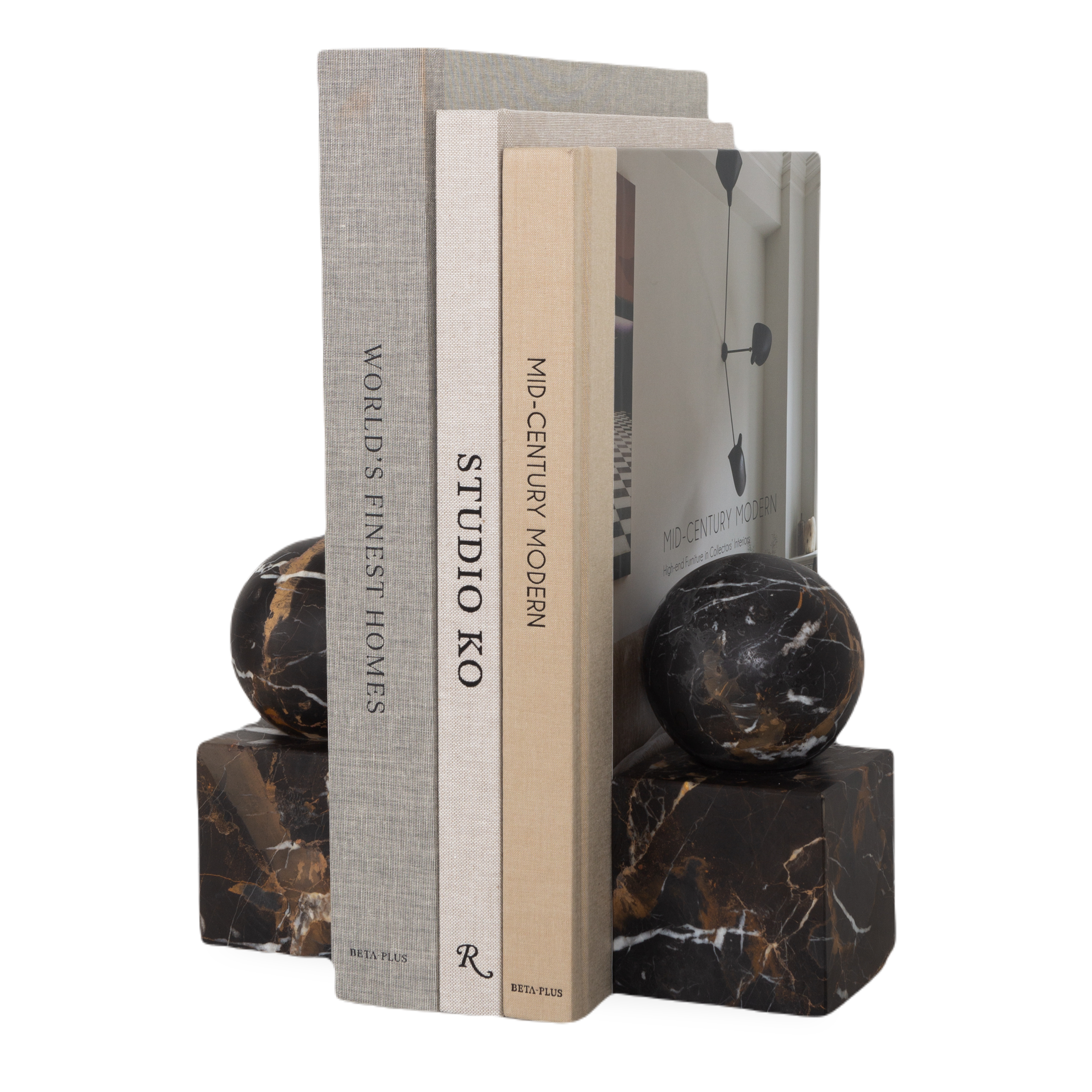 The Honed Marble Bookends feature a geometrical silhouette with a sphere sitting on a cube.