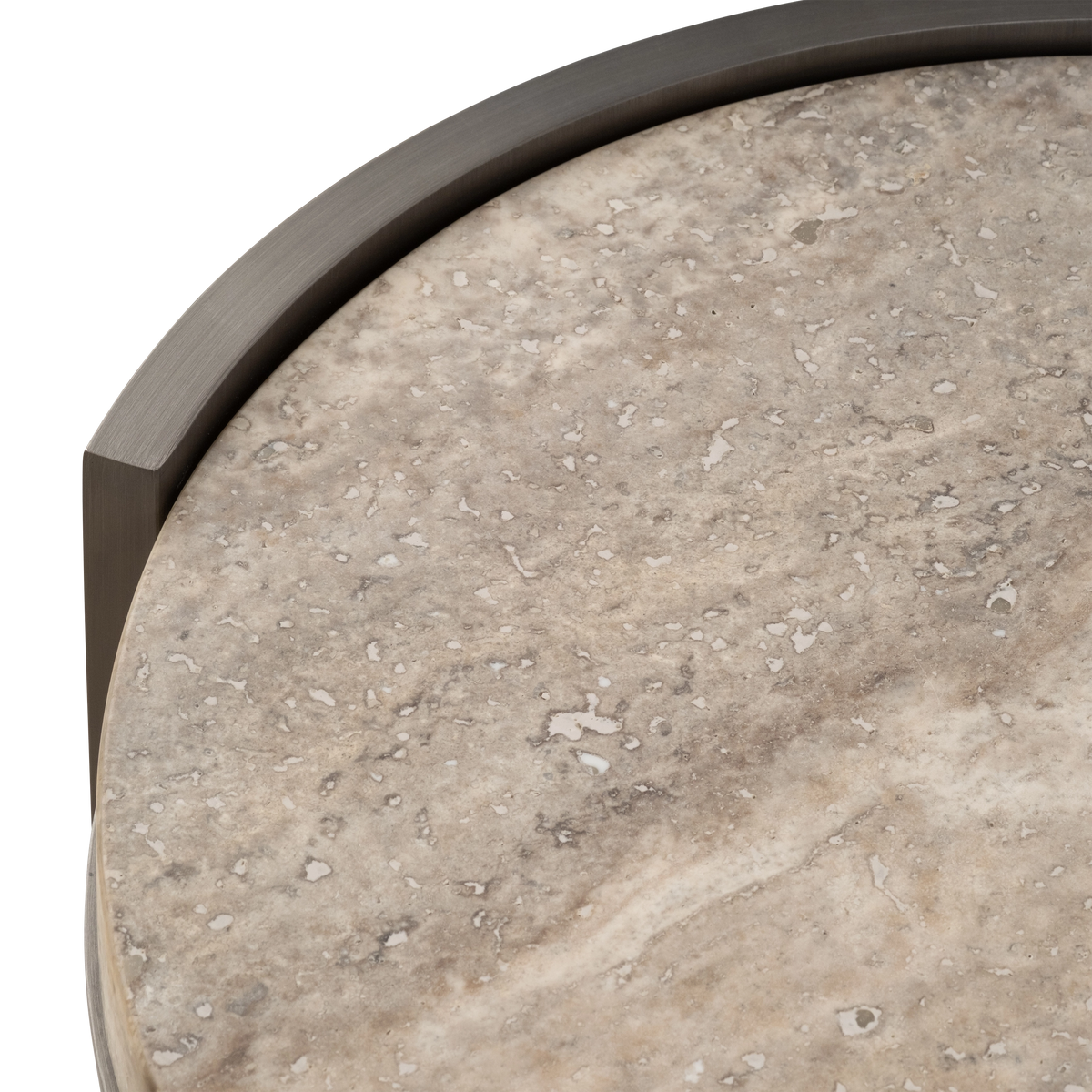 Close-up showing the Beam Side Table's honed taupe travertine top with natural pitting and soft veining, edged by a curved aged pewter brushed metal panel.
