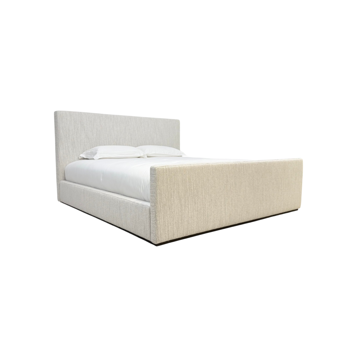 Vital Footboard King Bed three-quarter view showing the architectural headboard, substantial footboard and fully upholstered ivory frame.