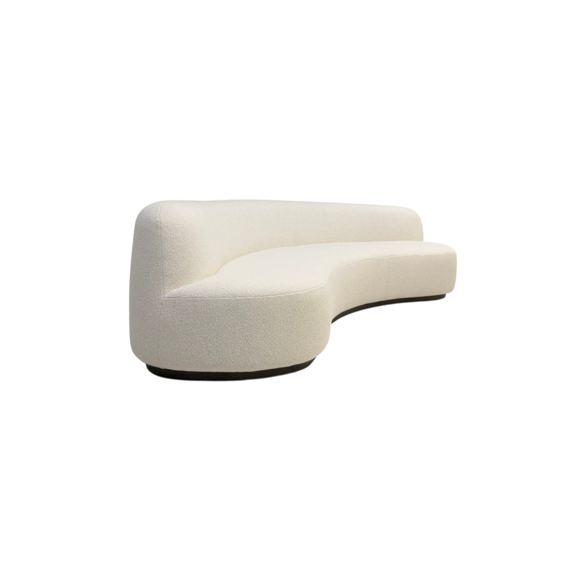 Rhine 120" Sofa in ivory bouclé, angled side view showing the sculpted curved seat, rounded back and grey oak plinth base.