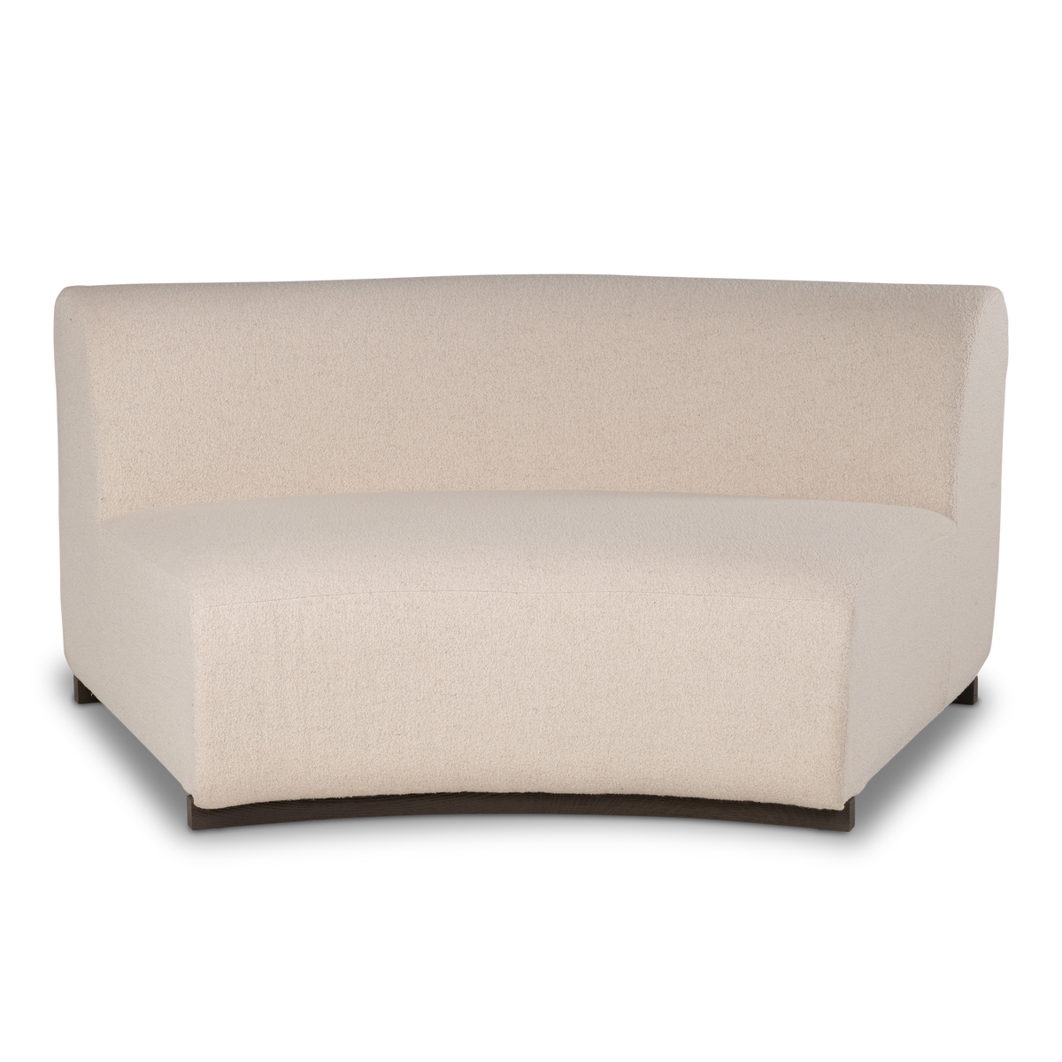 Rhine Modular Armless Chair shown in a side-angled view in cream bouclé, highlighting the rounded back edge, the deep curved seat, and the dark block foot beneath.