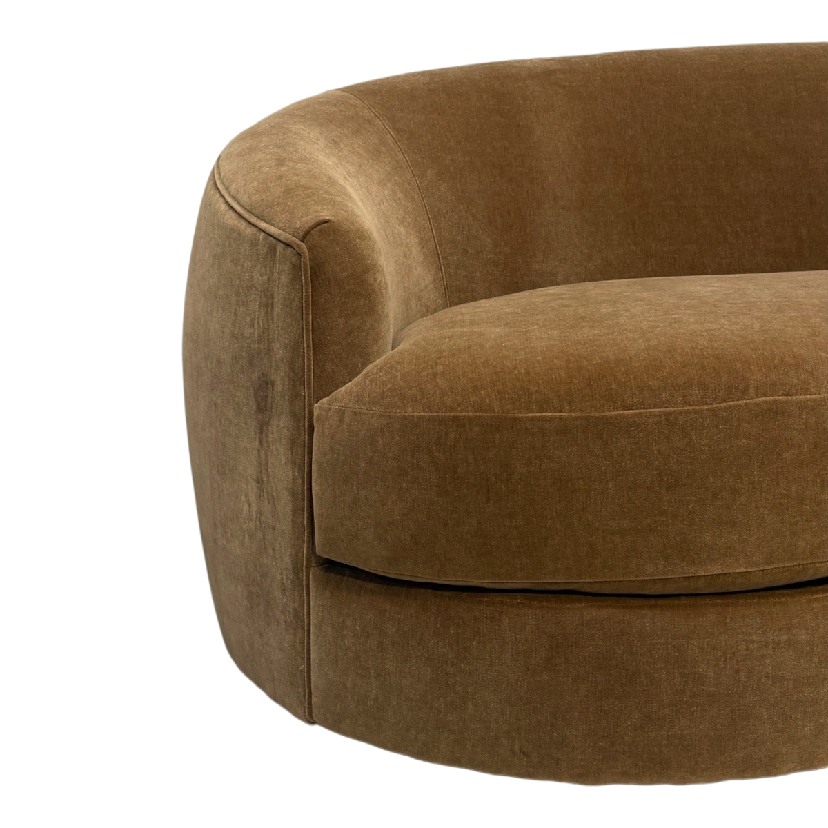 Close-up showing the Grace Sofa's rounded arm in Caramel velvet, with a piped seam, plush seat cushion and softly mottled pile.