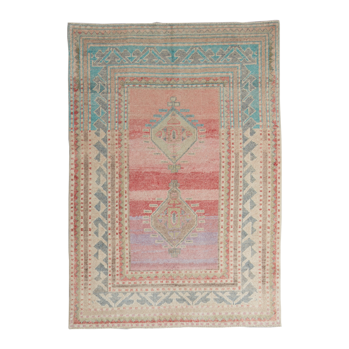 A rectangular area rug with a distressed geometric pattern, featuring a central field of dusty pink and red stripes with two diamond medallions, surrounded by teal, beige, and gray borders.