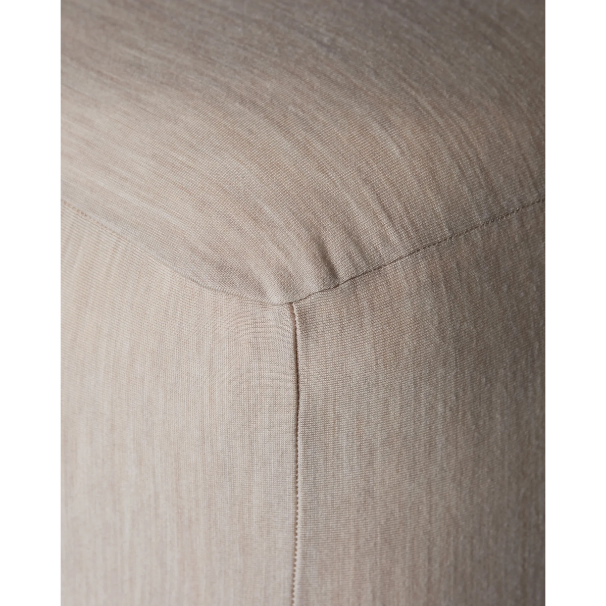 Close-up of Merino Fit Sheet Queen in Ivory showing the smooth jersey texture, fitted corner and tailored seam detail.