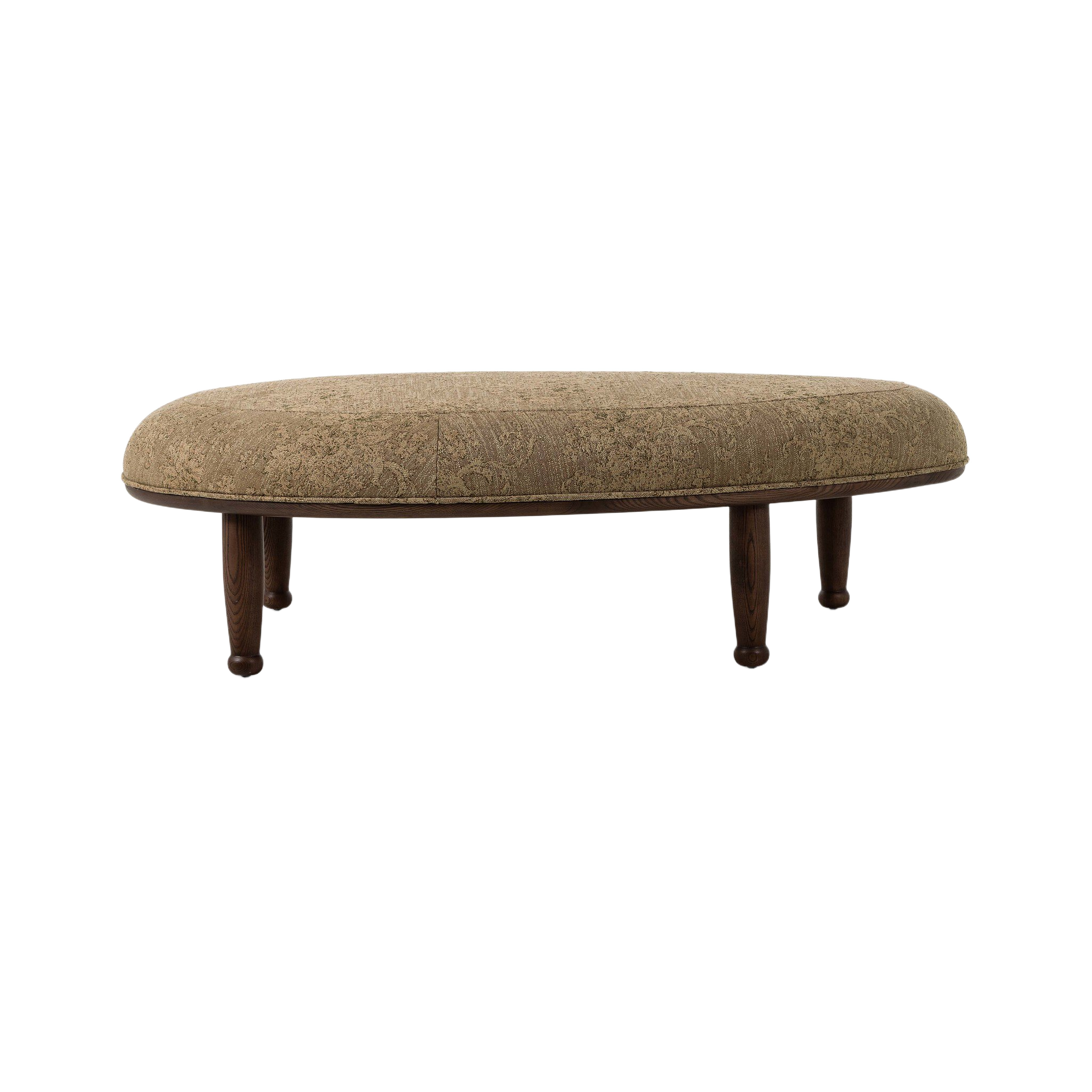 Flora Ottoman shown at an angle, highlighting its rounded upholstered profile, tonal floral pattern and dark wood base with turned legs.