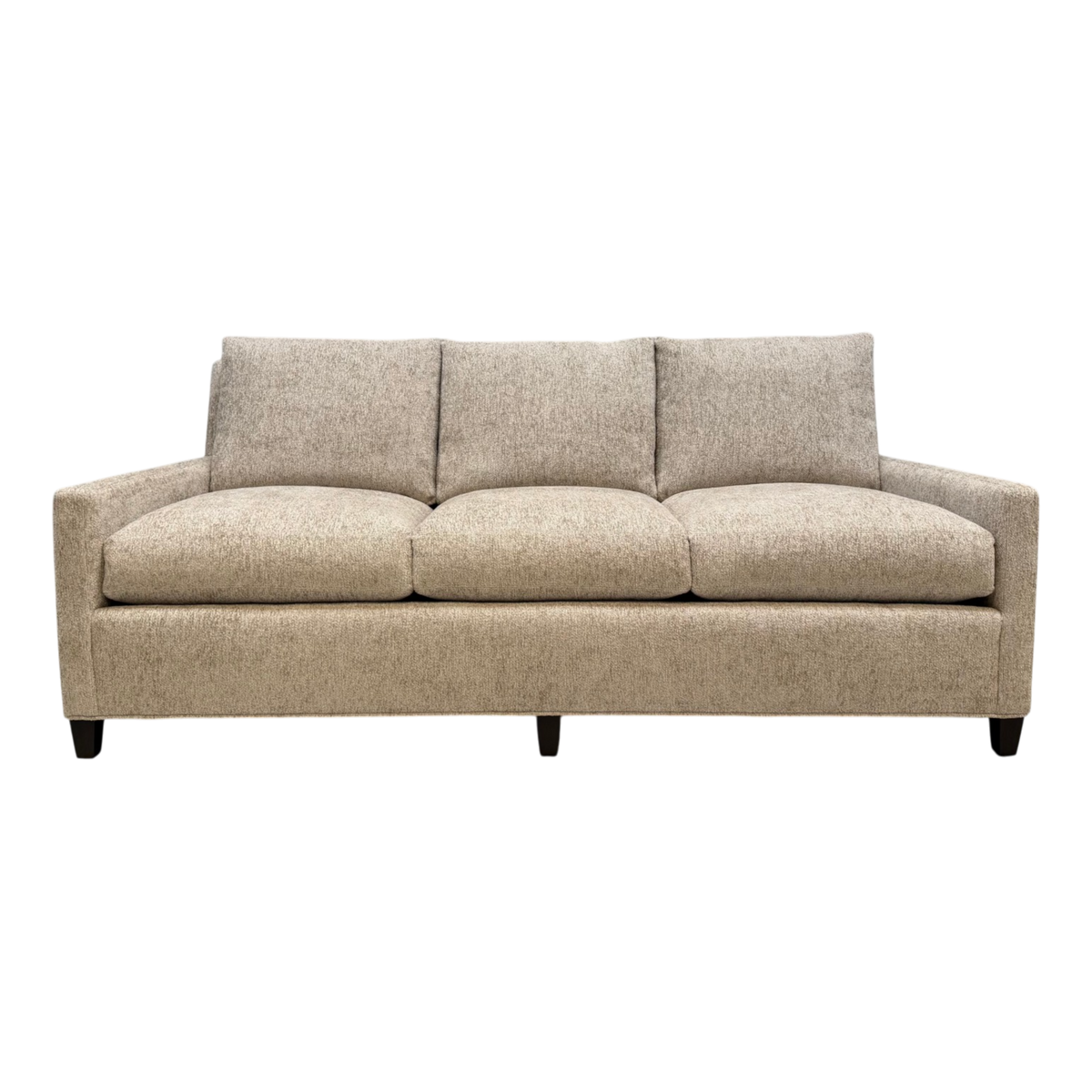 Front view of the Weston Sofa upholstered in Foundry Sand chenille, with three plush seat and back cushions, slim track arms and dark tapered legs.