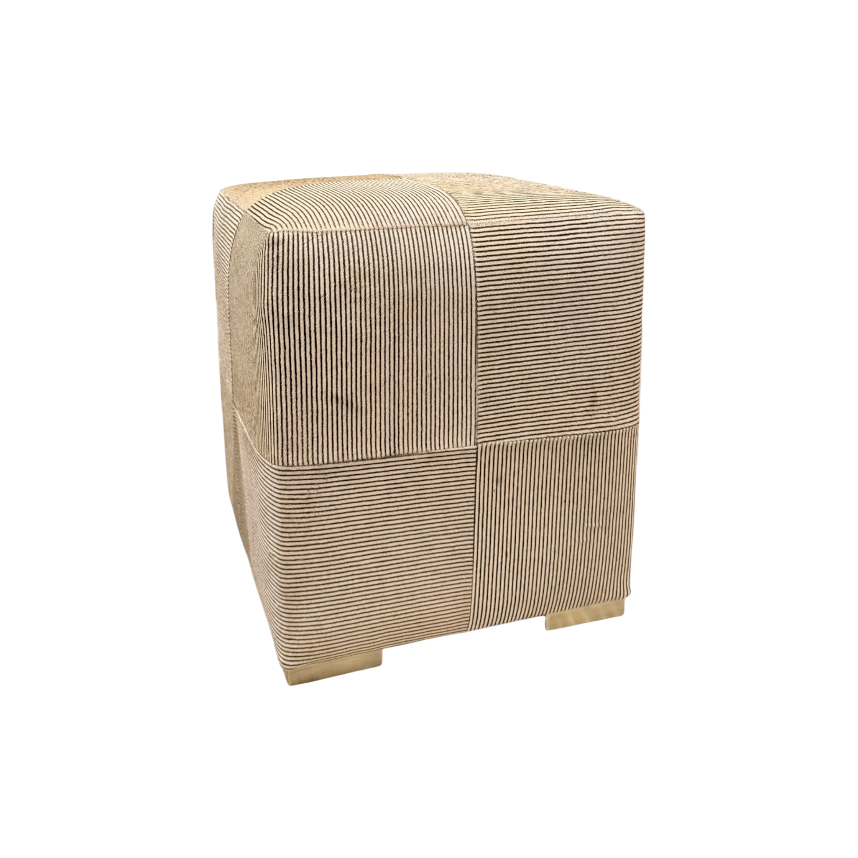 Angled view of Viktor Stool showing alternating striped hair-on-hide panels, softly rounded corners and brass block feet.