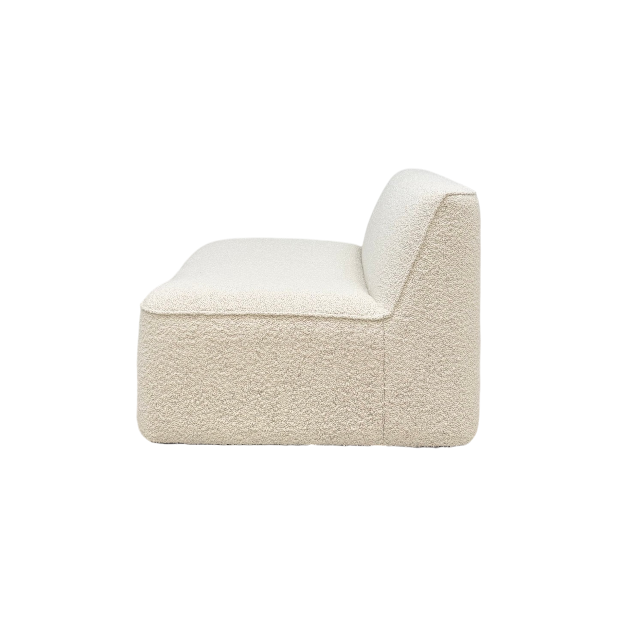 Bento Modular Armless Chair in ivory bouclé, side view showing the armless profile, low backrest, and seamless rounded form.