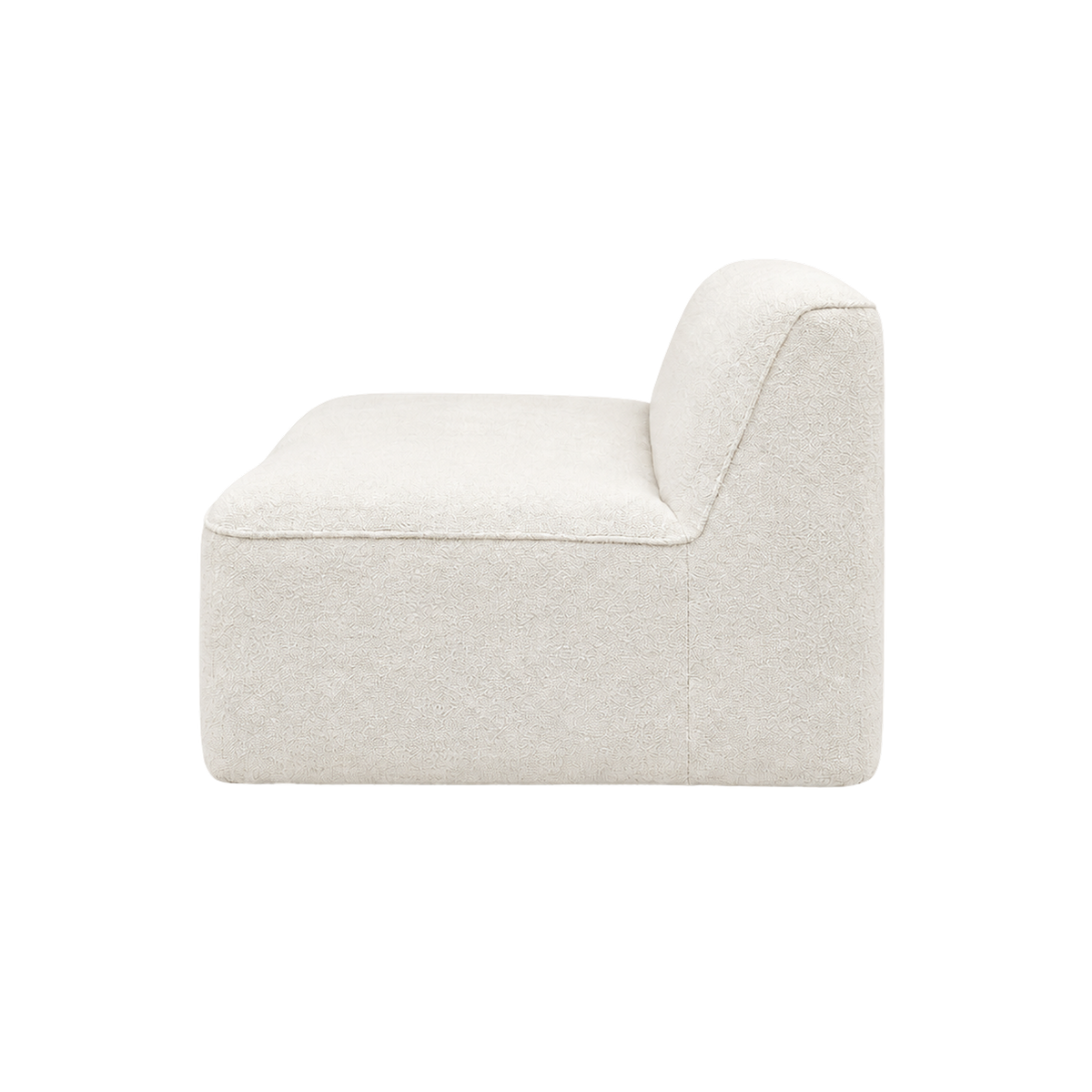 Bento Modular Armless Chair in ivory bouclé, profile view revealing the softly angled back, deep contoured seat and a fine piped edge above a rounded base.