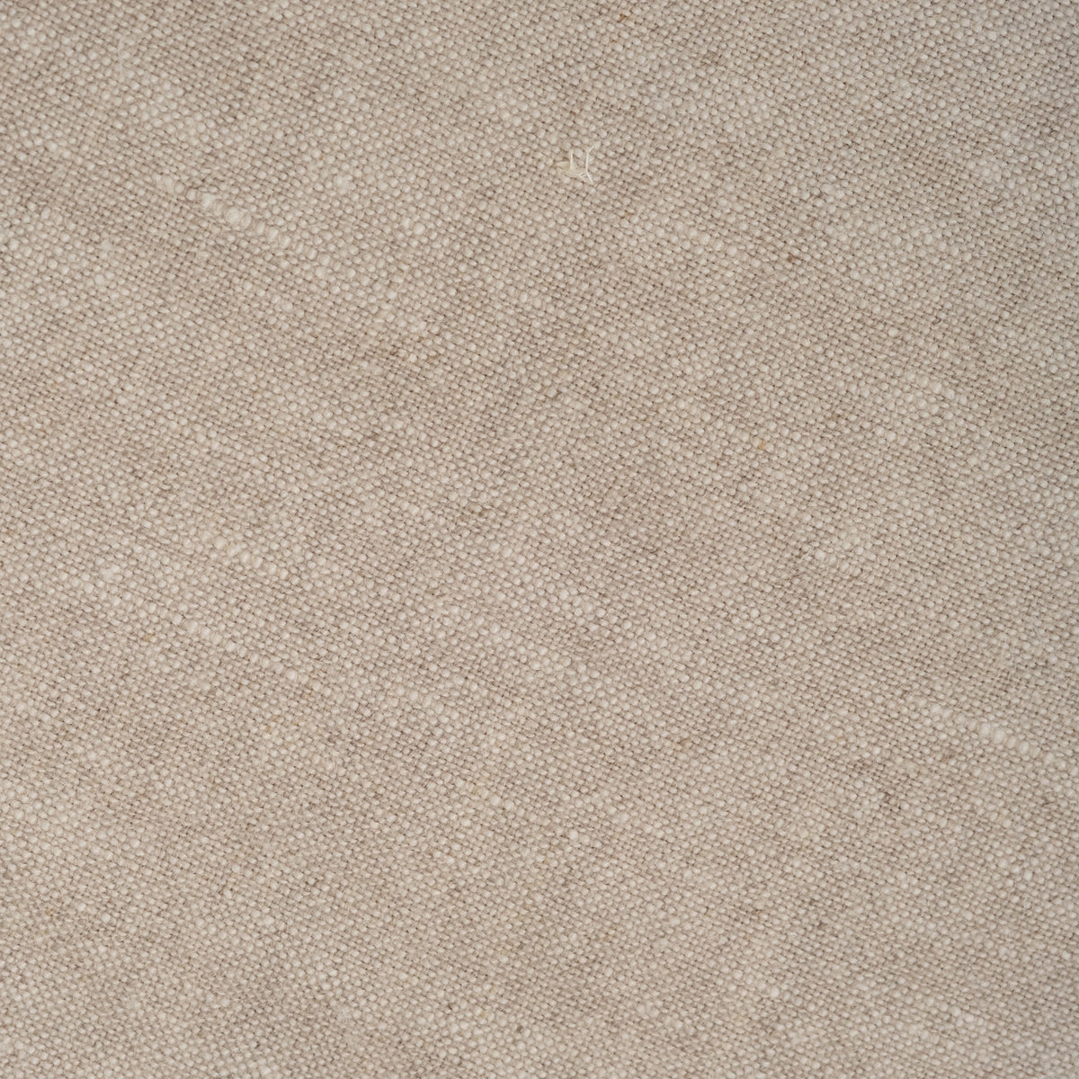 Close-up of the natural linen slipcover fabric on the Muse Queen Bed, with a loose, slubby weave in warm oatmeal tones.