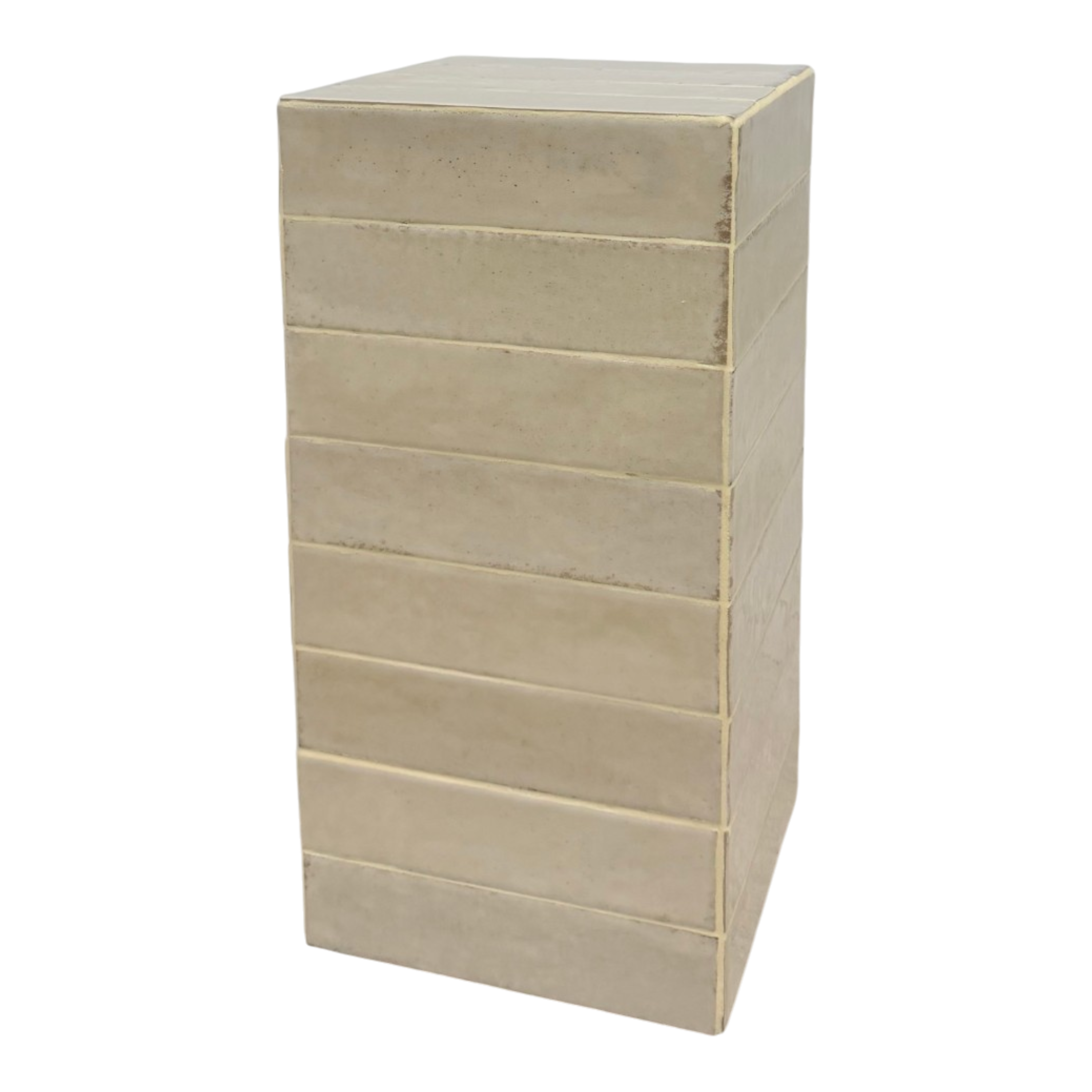 Bloor Ivory side table shown at an angle, highlighting its block-like form, stacked horizontal bands and softly varied handmade finish.