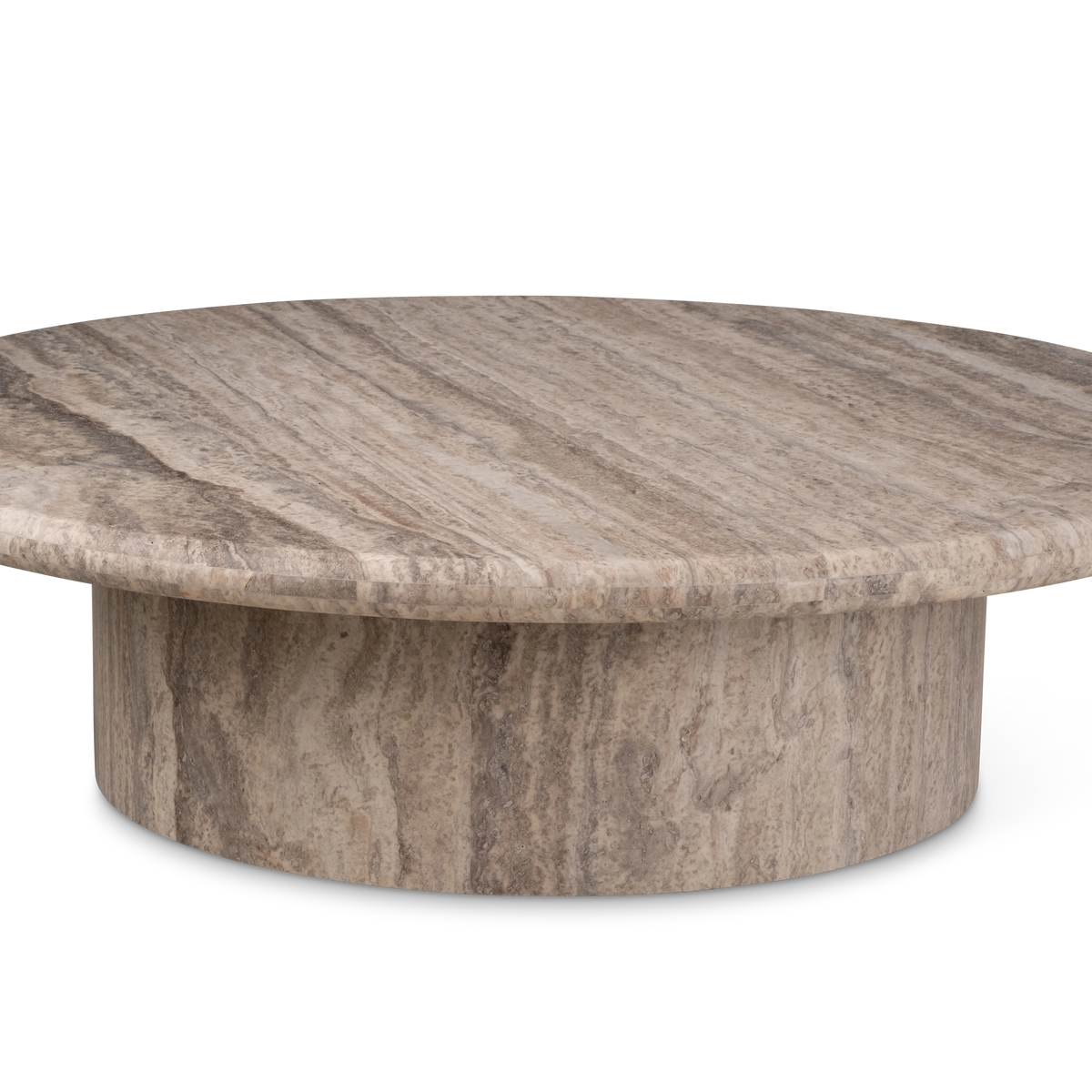 Angled view of the Aldo Coffee Table in Taupe travertine, with the honed top and drum base in profile and cream, tan, and grey veining running down the base.