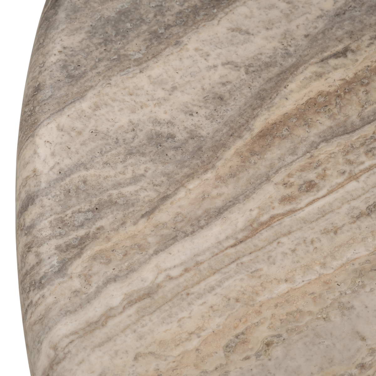 Close-up showing the curved edge of the Aldo Coffee Table in Taupe travertine, with soft grey and cream banding, fine pitting, and the smooth rounded rim of the honed top.