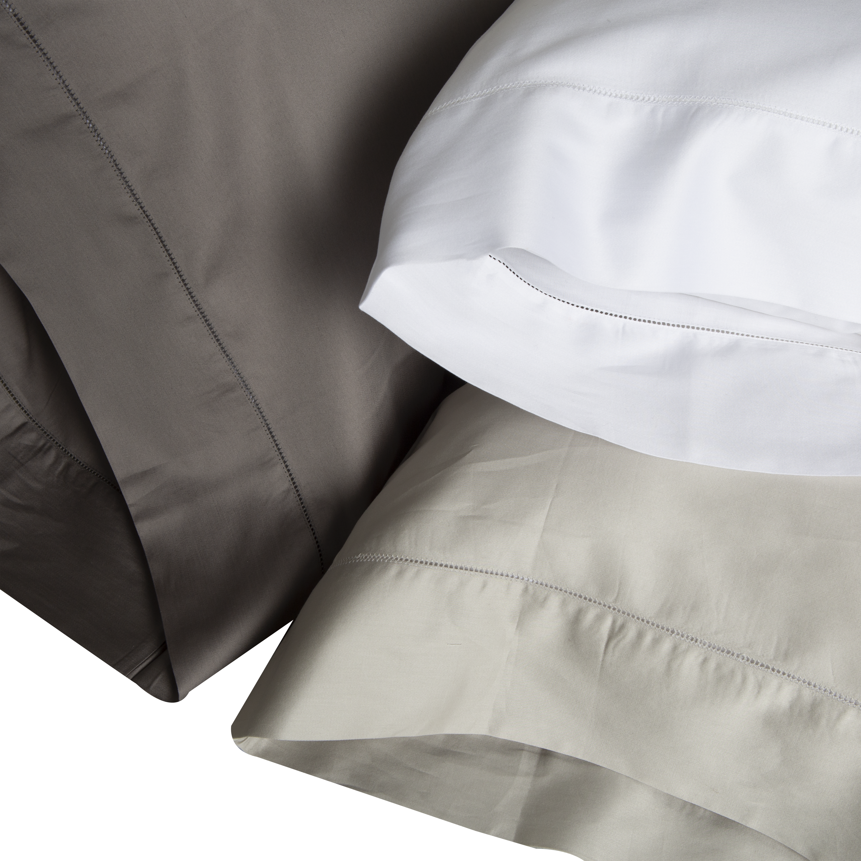 An elegant row of open hemstitching frames this silky, soft sateen collection.