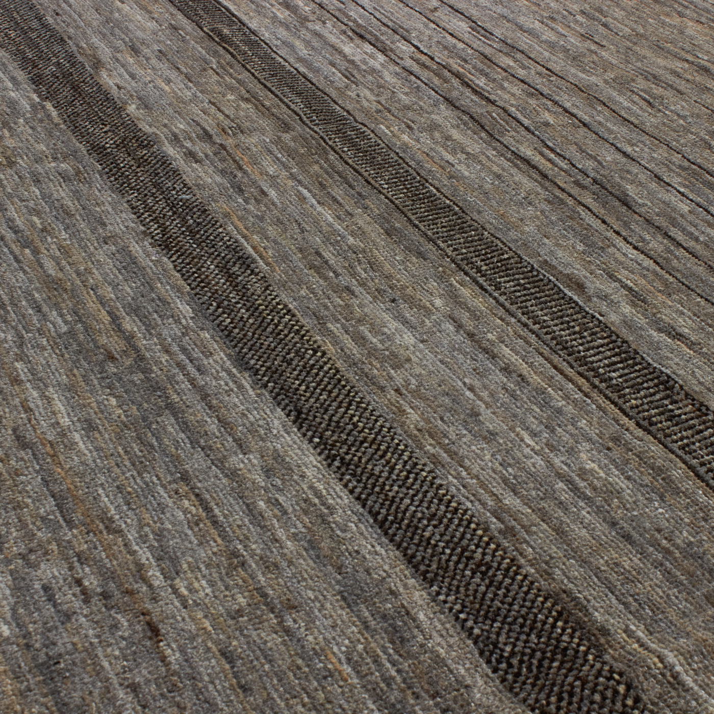 Revered for its lustre and soft hand, the natural qualities of wool from ancient Karakul sheep are honoured through restraint and refinement.