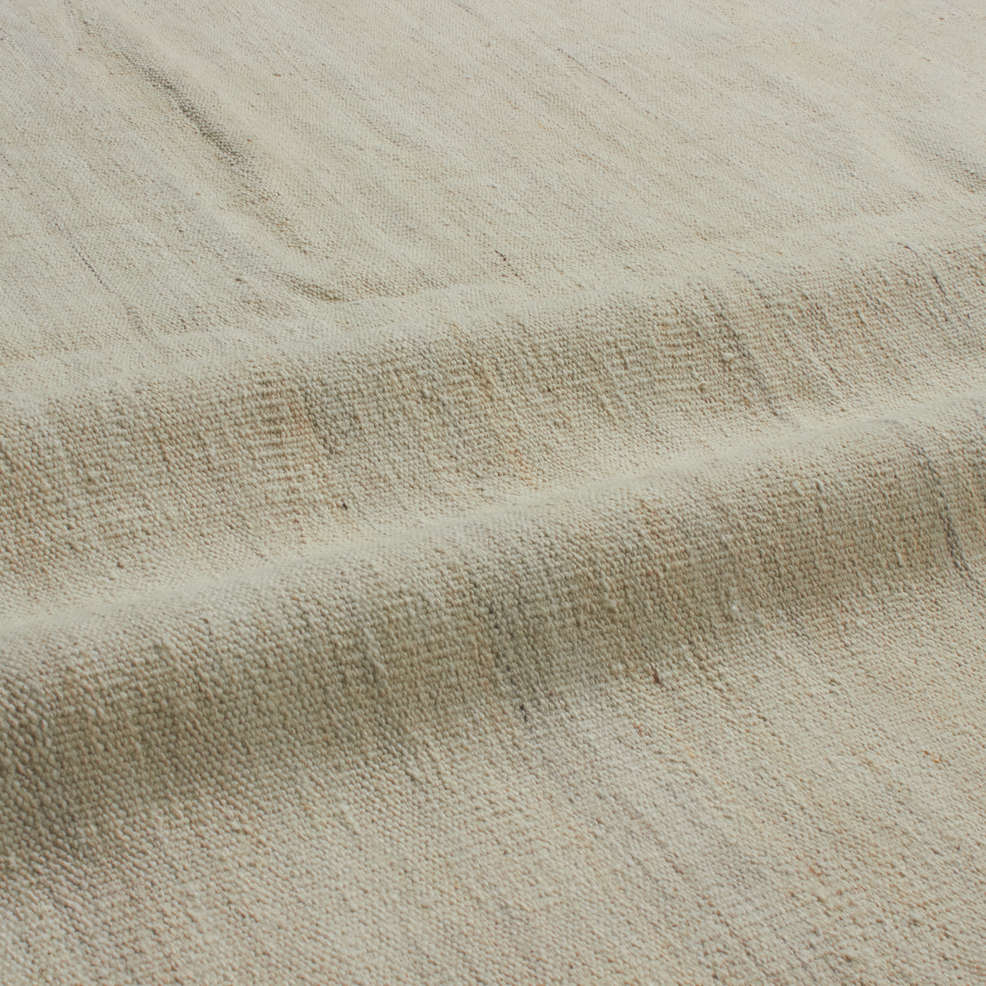 Revered for its lustre and soft hand, the natural qualities of wool from ancient Karakul sheep are honoured through restraint and refinement.