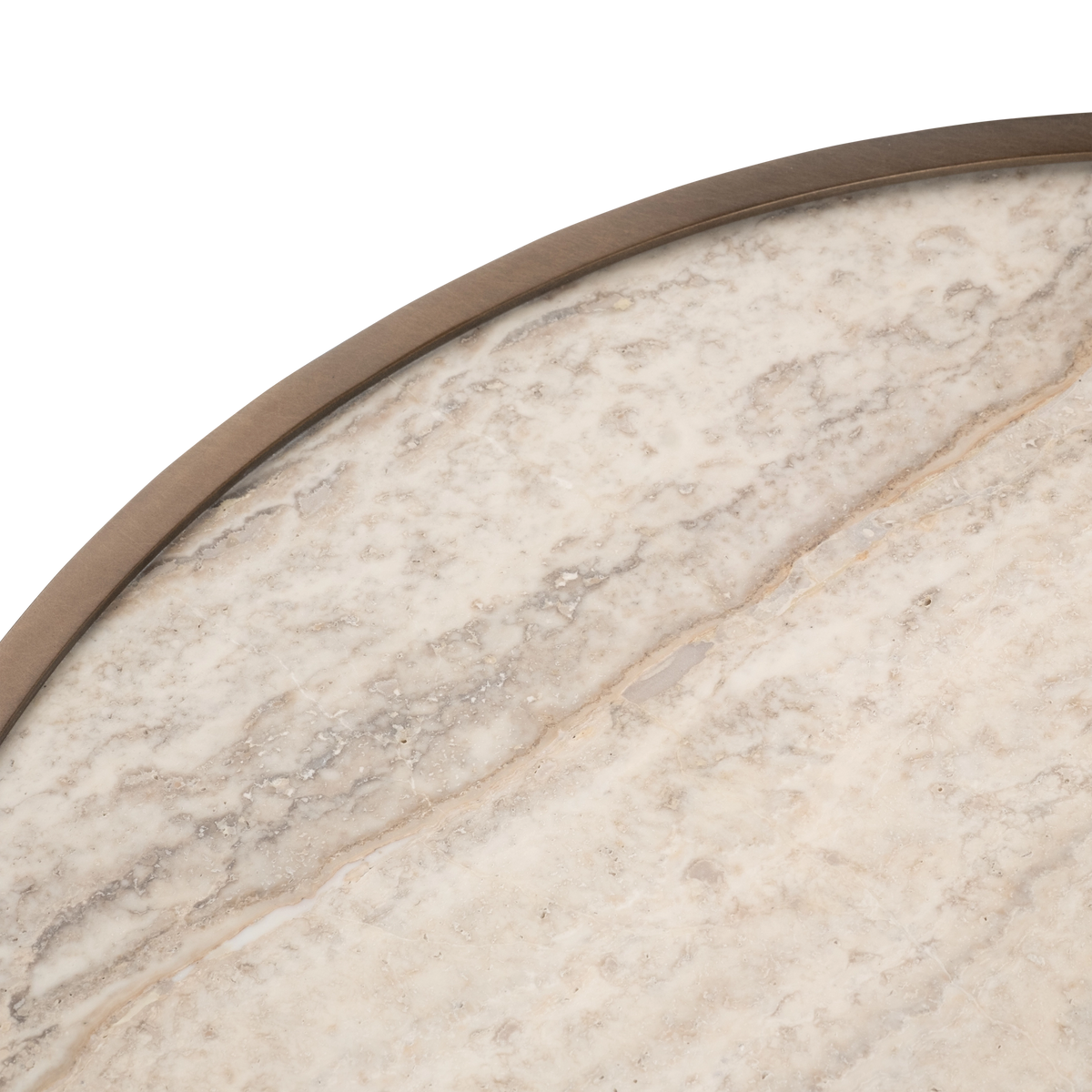 Close-up of the top edge of the Pedra Round Side Table in Aged Bronze, showing the slim brushed metal rim and a tan vein running diagonally across the cream travertine.