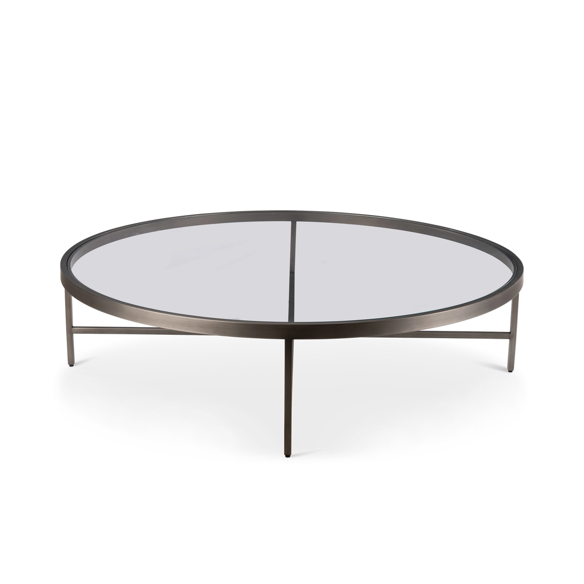 Tenor Round Coffee Table shown from a rotated angle in Aged Pewter metal and glass, highlighting the low profile and the center cross brace visible through the glass top.
