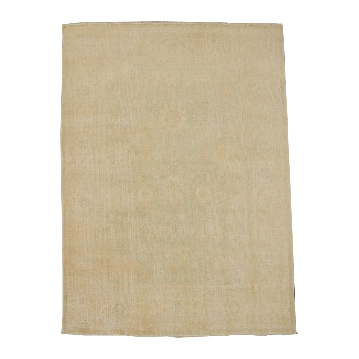 A rectangular vintage-style area rug in a faded beige and light green colorway, featuring a subtle distressed traditional floral pattern.