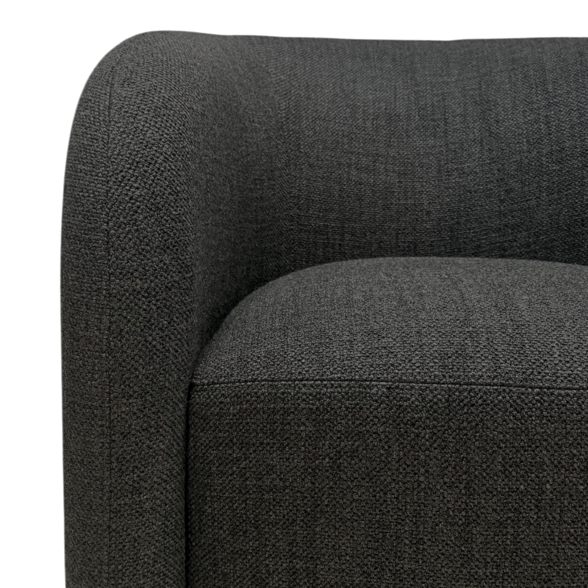 Close-up of Sigma Lounge Chair showing the curved arm, seat edge, and textured Ebony Oak upholstery.