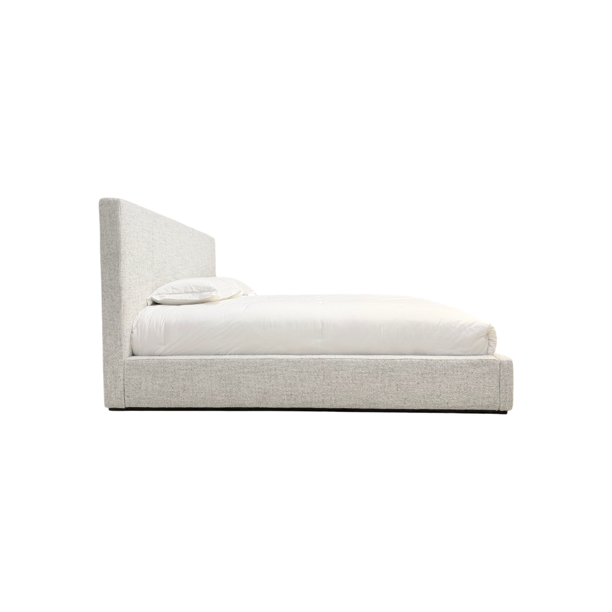 Vital King Bed side profile showing the upholstered headboard, low platform base and clean architectural silhouette.