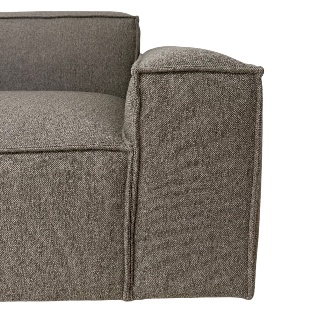 Vetro Modular RAF Chair close-up showing the heathered brown woven upholstery, piped edges and softly padded right track arm.