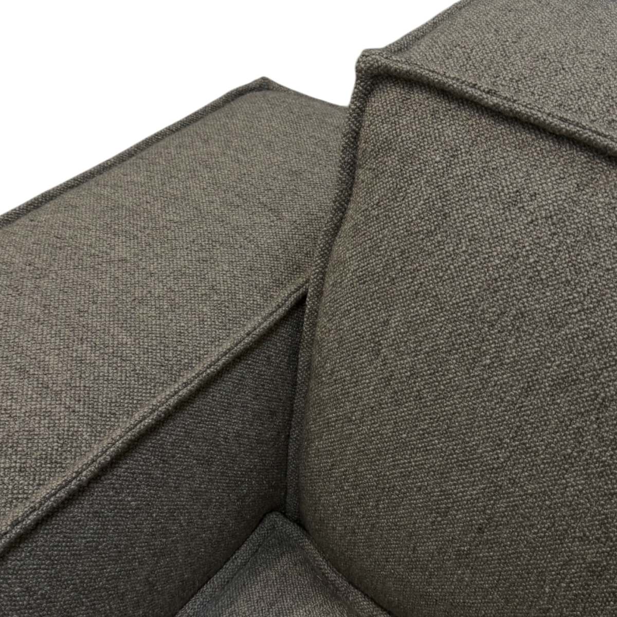 Vetro Modular LAF Chair close-up showing the textured heathered brown weave, piped seams and softly padded left track arm.