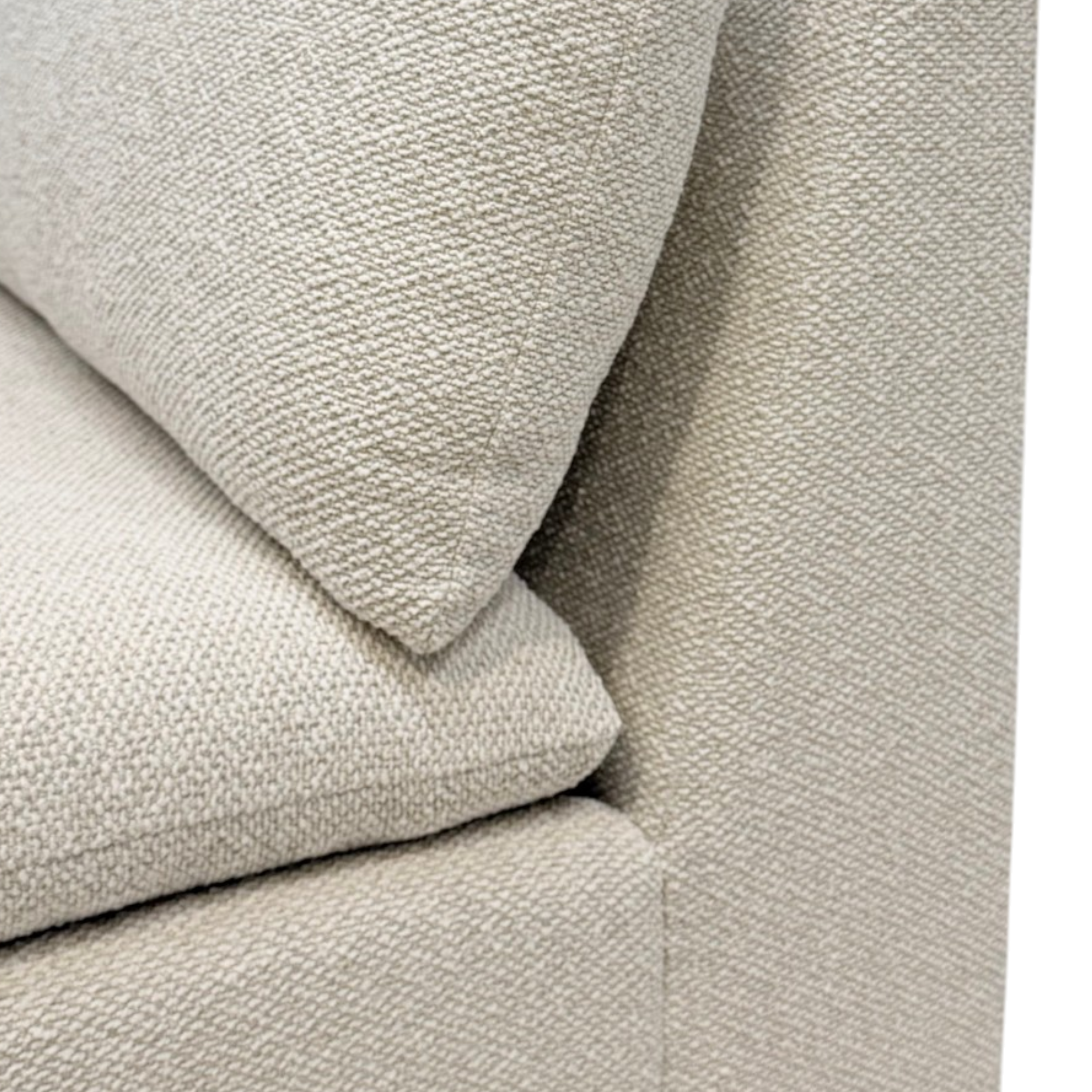 Tempo Modular Armless Chair close-up showing the textured ivory upholstery and layered loose seat and back cushions.