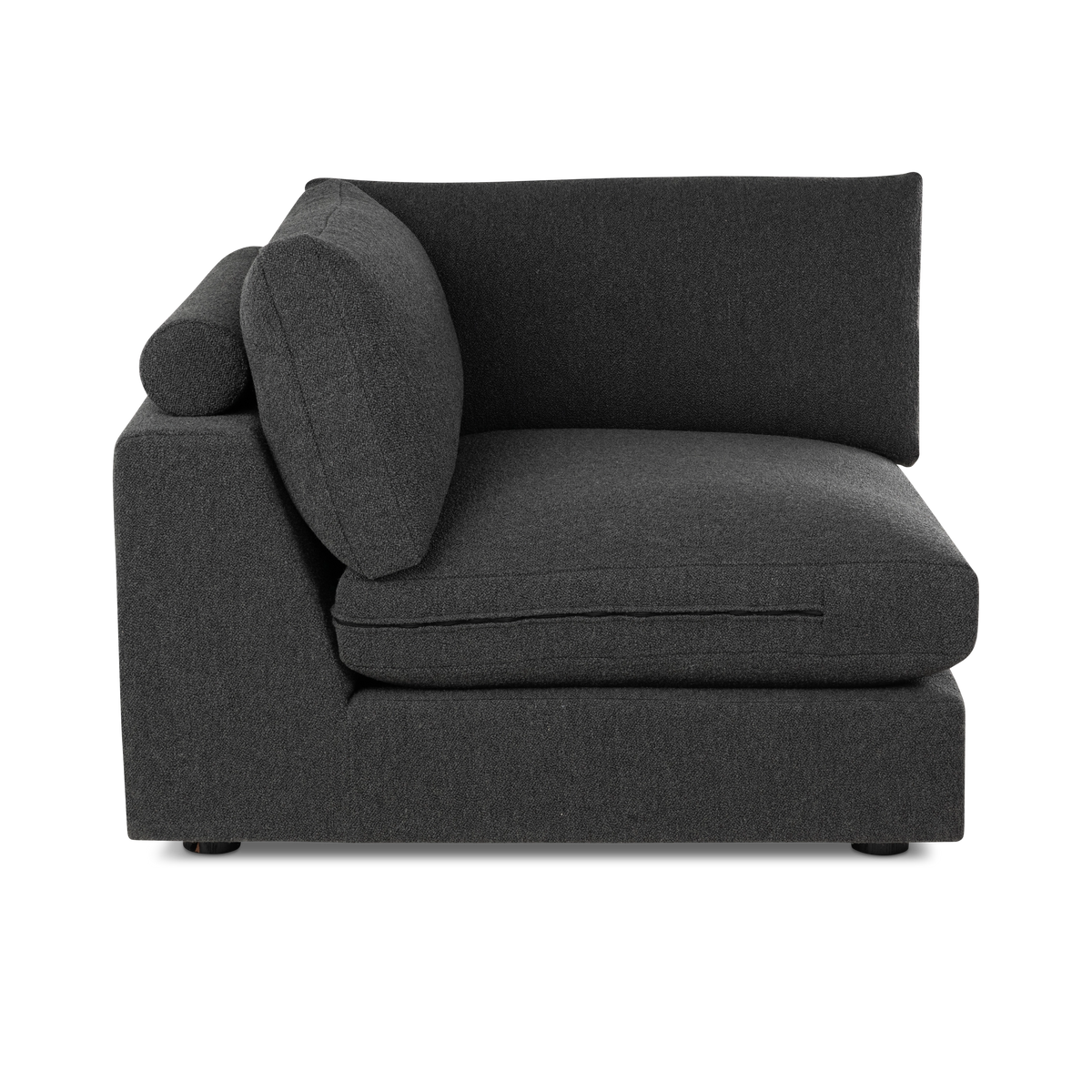 Colonna Modular Corner Chair in charcoal bouclé shown from the side, with the wide seat cushion, the tall back cushion, and the squared panel and bolster at the end.