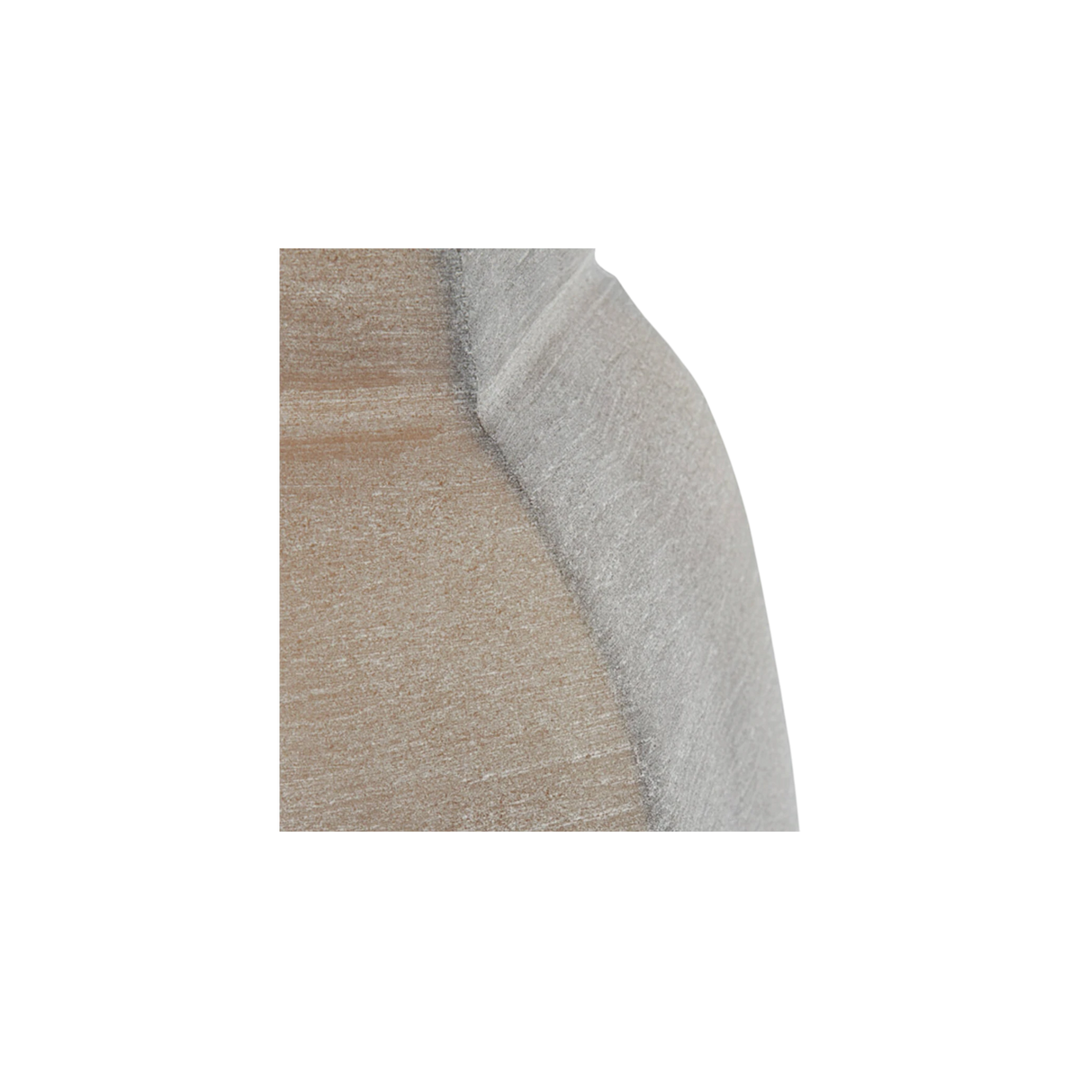 Close-up showing the seam between the sandy-brown panel and the pale grey-taupe facet of the smoked taupe glass vase, with a darker edge line and fine horizontal brushing.