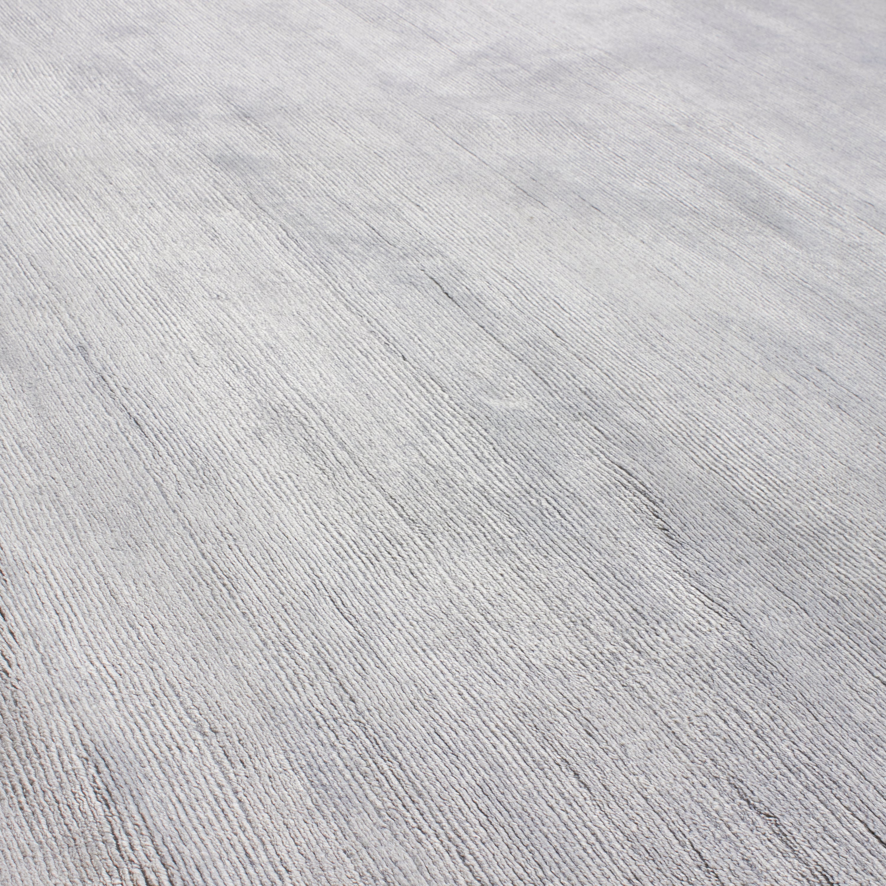 Through intricate weaves, knotting techniques and the use of colour, Elte's Solid and Textured rugs add warmth and depth to a space.