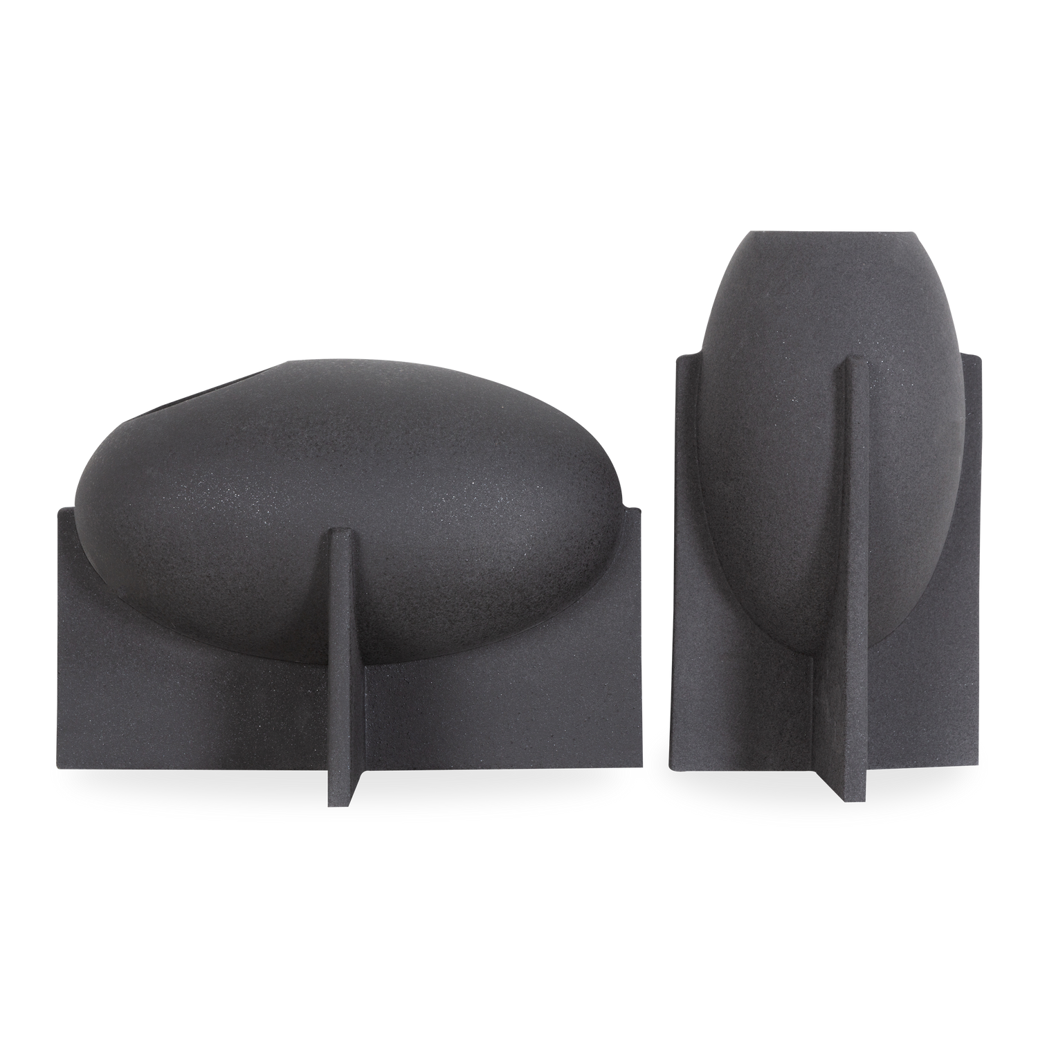 With clean lines and an amicable silhouette%2C the Amara Vase features a minimalist black ceramic body that sits atop an elevated cross base.