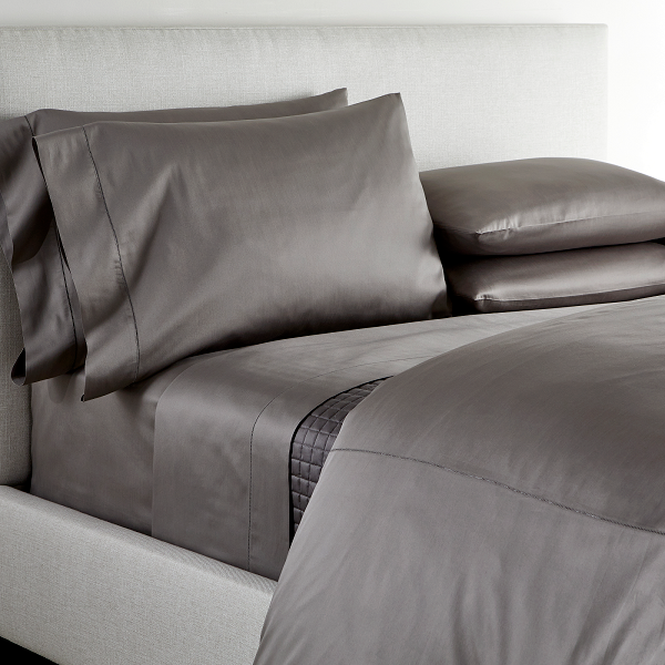An elegant row of open hemstitching frames this silky%2C soft sateen collection.