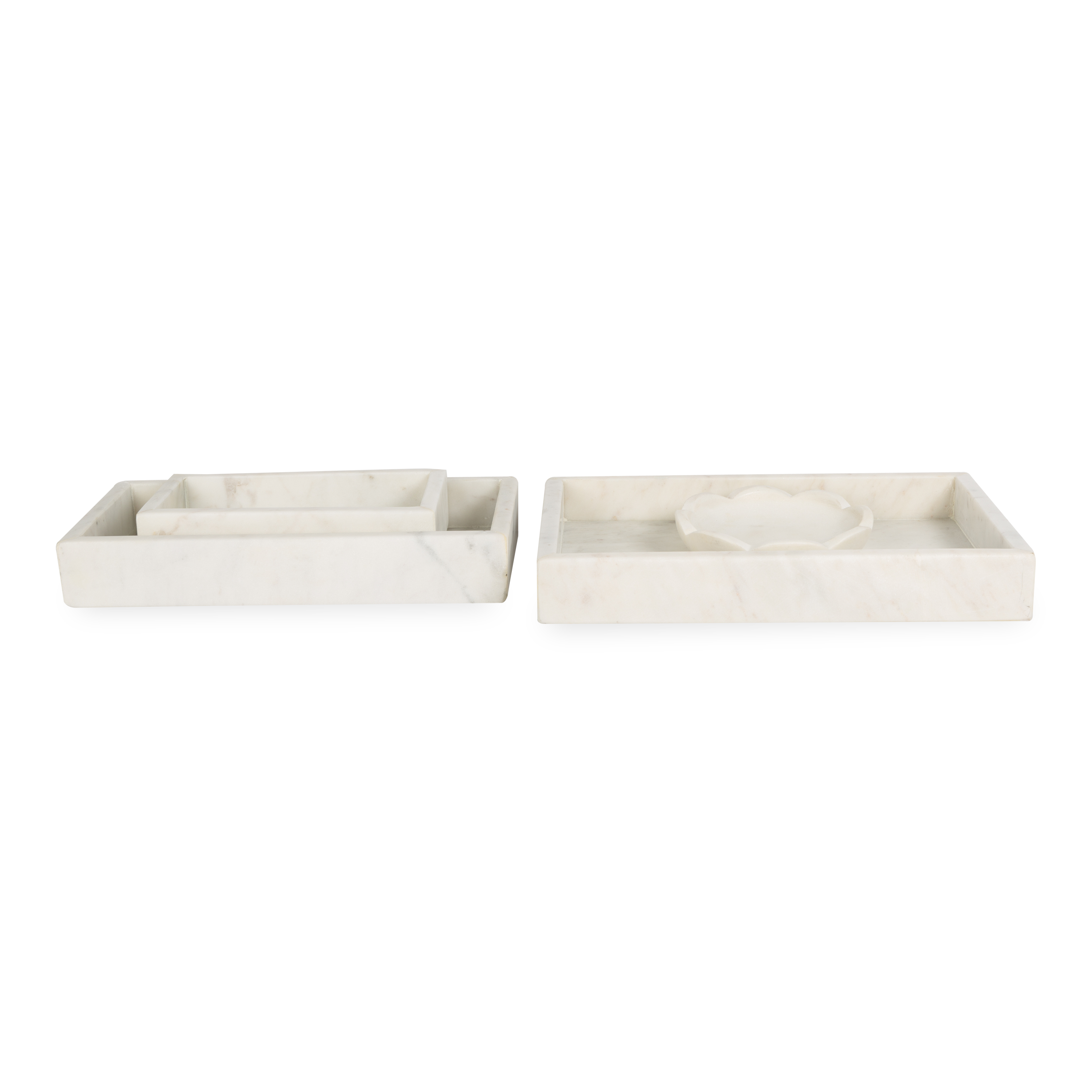 A collection of solid marble countertop pieces with a matte finish.